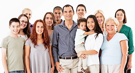 Mixed group of people facing the camera and smiling